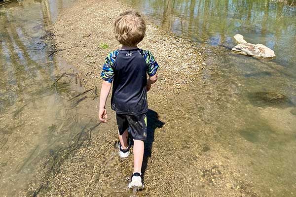 Nature Dads Creeking, young son walking through a creek